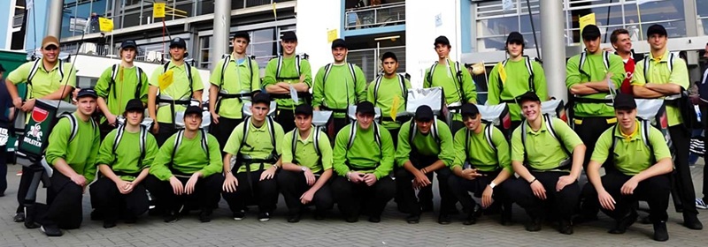 Professional backpack bottle dispenser at Houston trade fair for beverage companies showcasing vending solution